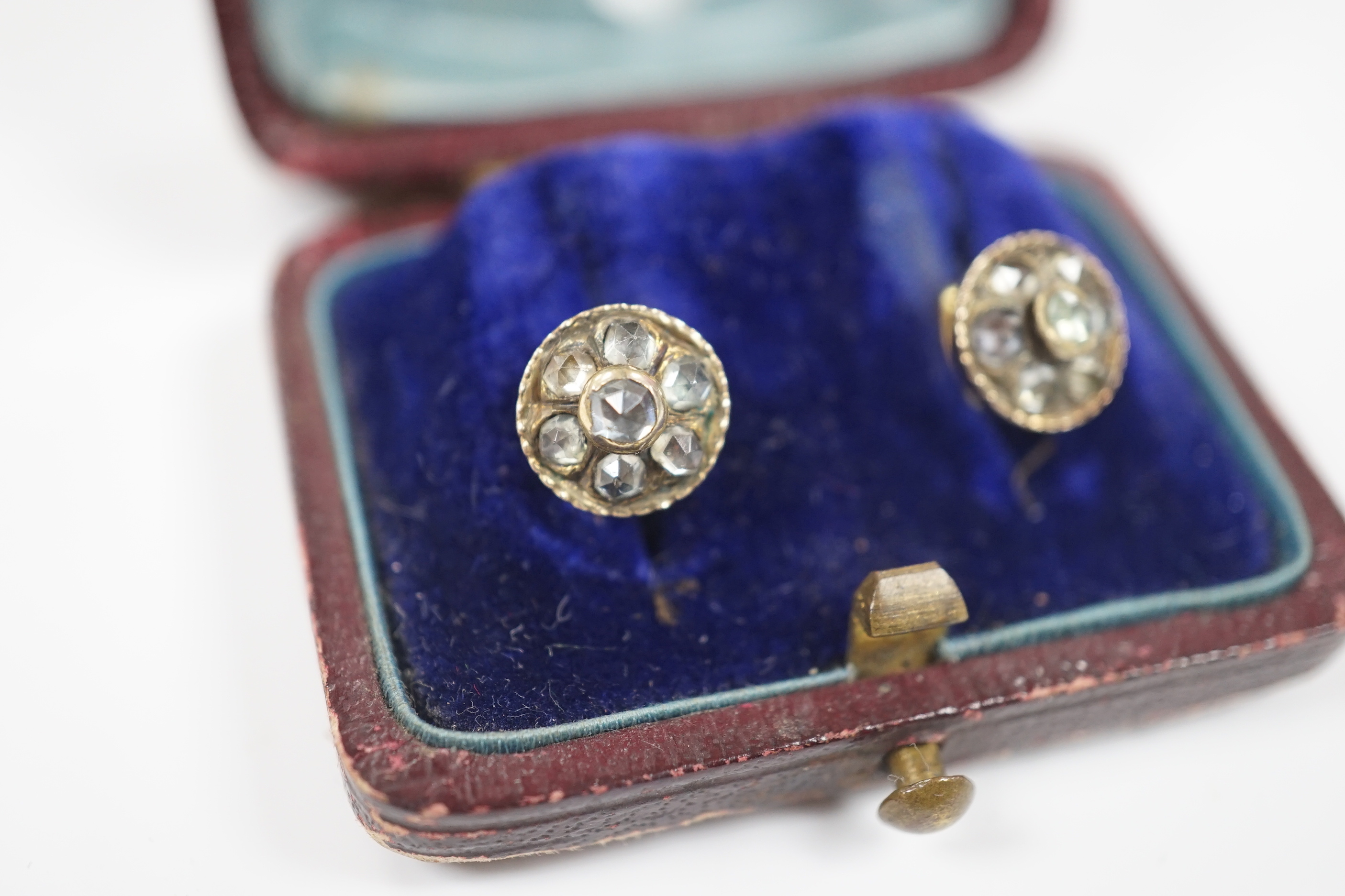 A pair of antique yellow metal and paste cluster set ear studs, diameter 9mm.